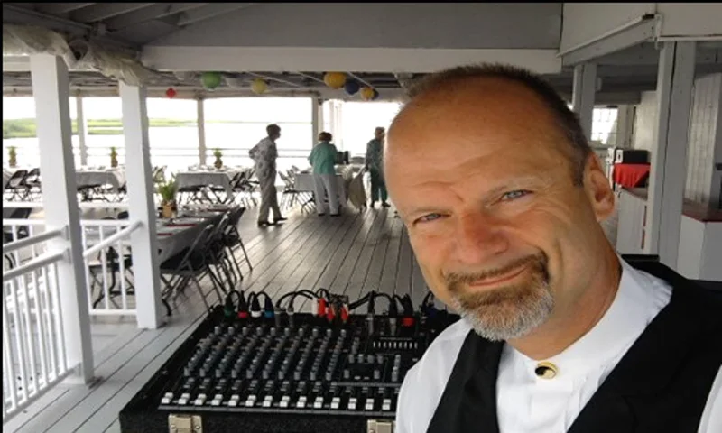DJ Don Cook, New Jersey event DJ and karaoke host, beside his mixer
